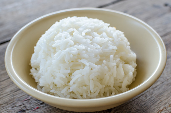 White rice in bowl on the wooden table