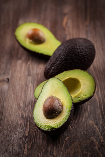 Avocado on wooden table